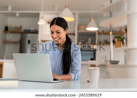 Happy young woman freelancer working on computer, studying online, shopping in internet store.