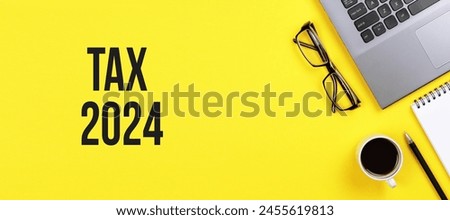 A laptop, eyewear, cup of coffee, and notebook on a yellow background. The items are arranged neatly in a yellow rectangle. Graphics and font show automotive design inspiration. Brand logo visible