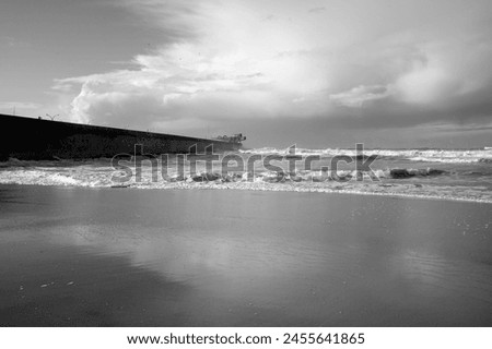 Beautiful beach from the north of Portugal during low tide. Converted black and white.  Royalty-Free Stock Photo #2455641865