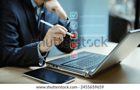 Document management system DMS. Business assessment form, Wrong and right survice questionnaire, checklist audit task form. Businessman work on laptop computer screen, fill survey form online. 
