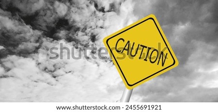 Hurricane Idalia warning sign against a powerful stormy background with copy space. Dirty and angled sign with cyclonic winds add to the drama.hurricane season sign on cloudy background Royalty-Free Stock Photo #2455691921