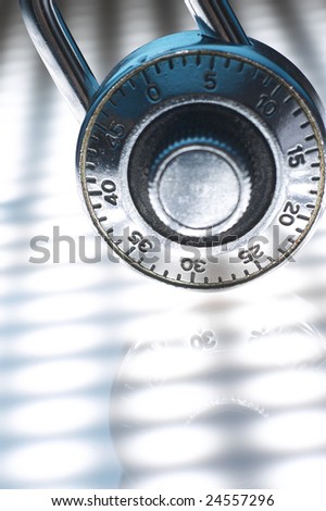 combination lock on the white background with reflection