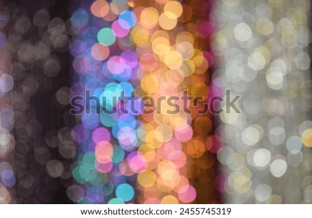 Intentionally blurred background with vibrant colors and reflections perfect for a lively and dynamic background