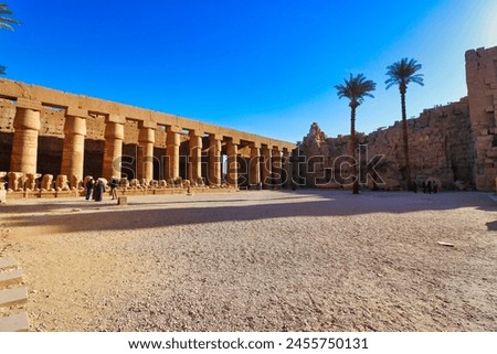 The outer courtyard of the Kom Ombo temple with a line of ram headed sphinxes at the Temple of Sobek and Haroeris built in 2nd century BC by Ptolemy pharoahs in Kom Ombo,Near Aswan,Egypt Royalty-Free Stock Photo #2455750131
