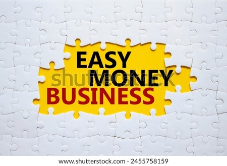Easy Money Business symbol. Concept words Easy Money Business on white puzzle. Beautiful yellow background. Business and Easy Money Business concept. Copy space.