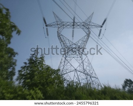 just a high voltage electricity tower building Royalty-Free Stock Photo #2455796321