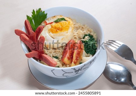 Mie Instant Sosis Telur or Instant Noodle with Sausage and Fried Egg. served in A Bowl.
