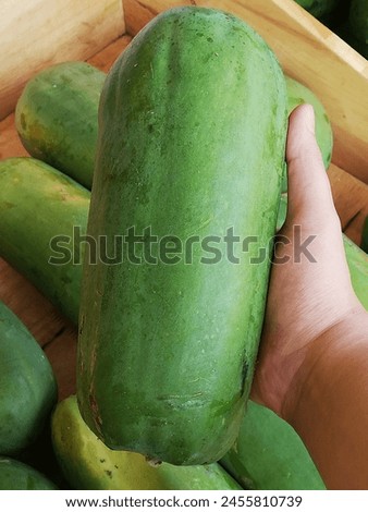 Photos of papaya that sold in traditional fruit market which was tasty and good for health. It was considered one of vitamin source on rich ingredients and benefit for maintaining good digesting organ