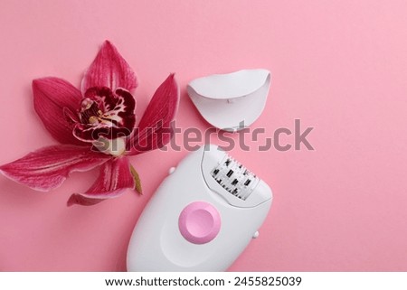 modern epilator for removing unwanted body hair on a bright background. Home hair removal method