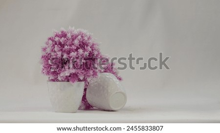 Close up picture of plastic pot and plastic flower. Plastic pot photography . Stock photography.