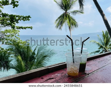 aperitif with a beautiful view of the sea, summer holidays, Thai sea, relaxation and drinks Royalty-Free Stock Photo #2455848651
