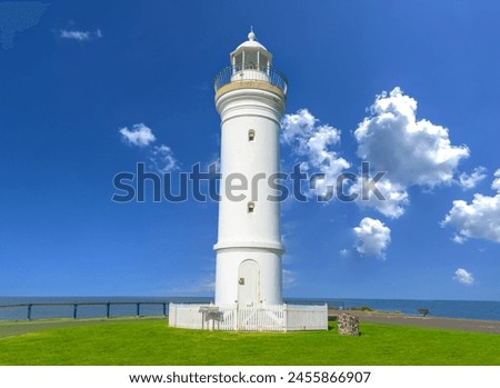 Beautiful lighthouse looking over the Pacific Ocean on cliffs of Kiama Sydney NSW Australia Coastal Beach fishing Town