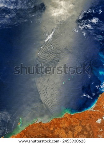 Atmospheric gravity waves off northwestern Australia. Atmospheric gravity waves off northwestern Australia. Elements of this image furnished by NASA. Royalty-Free Stock Photo #2455930623