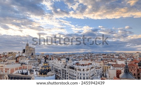 Panoramic aerial view of Gran Via timelapse before sunset, main shopping street in Madrid Skyline Old Town Cityscape, Metropolis Building, capital of Spain, Europe