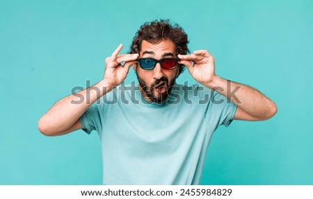 young adult hispanic crazy man with 3d cinema glasses