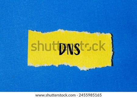 DNS word written on ripped yellow paper with blue background