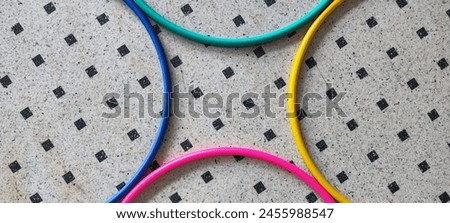 Visual effect created by colorful hula hoops laid on the floor 