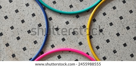 Visual effect created by colorful hula hoops laid on the floor 