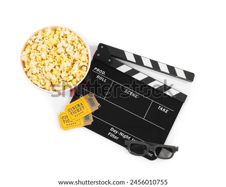 Movie clapper, bucket of tasty popcorn, cinema tickets and glasses isolated on white, top view
