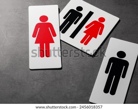 Restroom sign on darke background