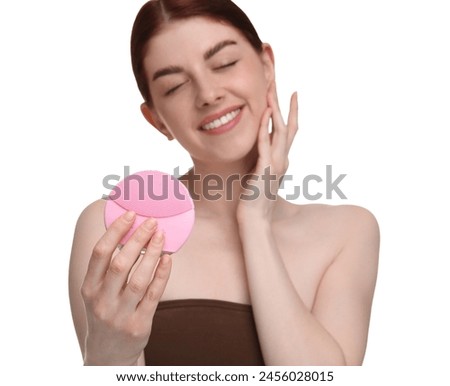 Washing face. Young woman with cleansing brush on white background, selective focus