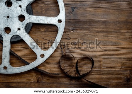 Cinema industry and movie background with film reels, top view.