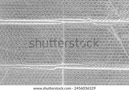 Silver color transparent bubble film surface texture background packaging light structure backdrop.