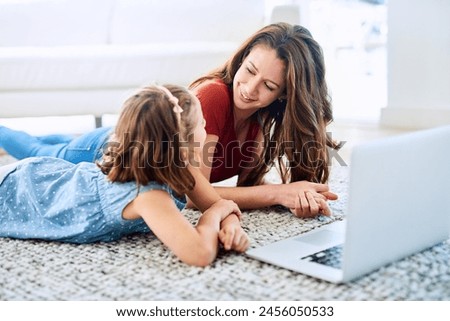 Mother, girl and laptop for homeschool in home, online class and remote learning or education on floor. Daughter, mama and streaming cartoon or app for development, bonding and support in childhood