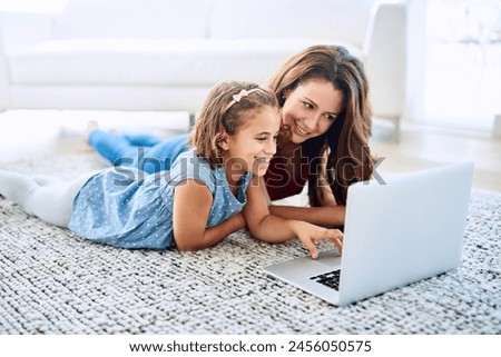 Mother, girl and laptop for education in home, online class and remote learning or care on floor. Daughter, mama and streaming cartoon or app for child development, bonding and support in childhood