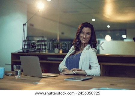 Portrait, night and business with woman, laptop and smile with human resources, confidence or career ambition. Face, evening or compliance officer with computer, internet or professional with startup Royalty-Free Stock Photo #2456050925