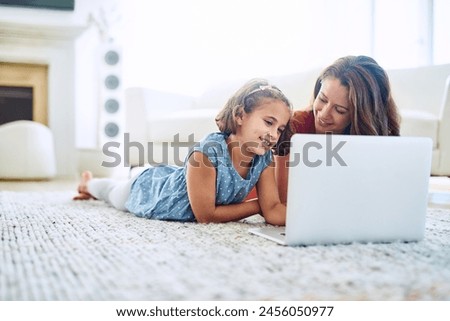 Mother, girl and laptop for learning in home, online class and remote homeschool or education on floor. Daughter, mama and streaming cartoon or app for development, bonding and support in childhood