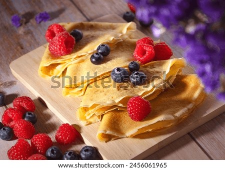 colorful picture pancakes dessert with fruits strawberries blueberries