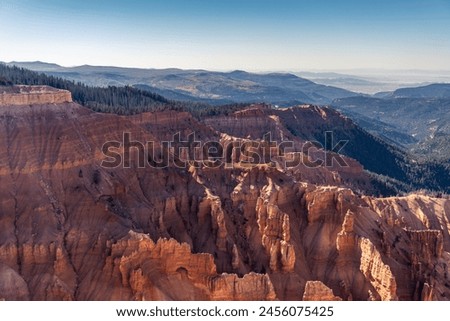 Cedar Breaks National Monument in Utah. A natural amphitheater filled with hoodoos, windows, canyons, spires, walls, and steep cliffs. A veiw from the canyon rim.  Royalty-Free Stock Photo #2456075425