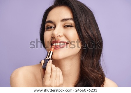 Woman enhancing her natural beauty by applying lipstick.