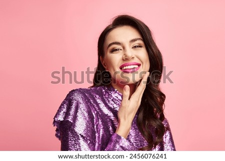A captivating woman in a purple top striking a pose.