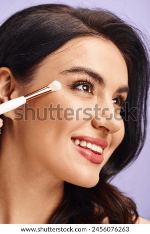 A woman enhancing her natural beauty by applying makeup with a brush.