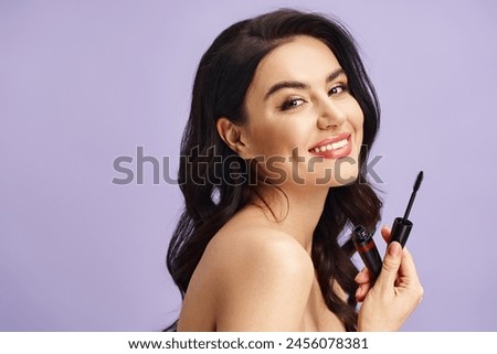 A woman enhances her natural beauty with a black mascara in hand.