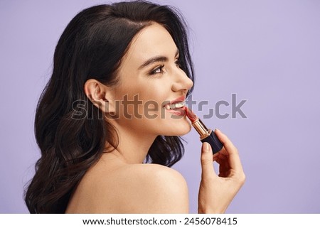 A woman enhancing her natural beauty with a lipstick tube.