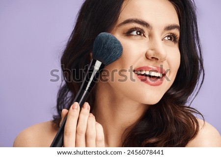A woman gracefully holds a makeup brush, enhancing her natural beauty.