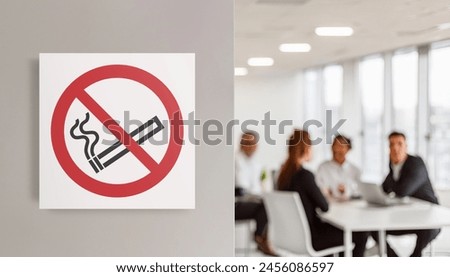Close up of a no smoking sign on the blurred background of an office. Concept of health, respect for rules, healthy environment and safety at work.