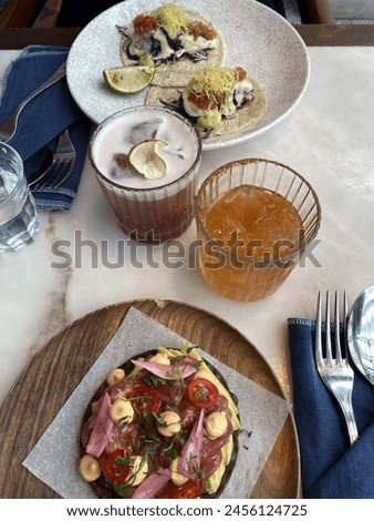 Shared dining: a tuna tostada and codfish taco’s!