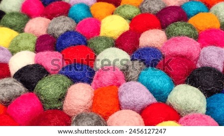 Multi colored felt bag rug. beautiful wool color background. colorful texture. Royalty-Free Stock Photo #2456127247