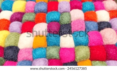 Multi colored felt bag rug. beautiful wool color background. colorful texture. Royalty-Free Stock Photo #2456127385