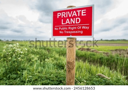 Shallow focus of a newly erected Private Land sign. Installed by the land owner to prevent unauthorised access to the arable land.