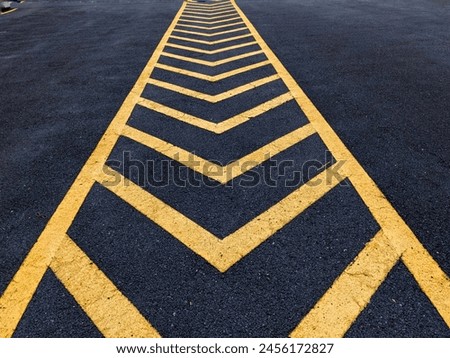 black asphalt road and yellow dividing lines Royalty-Free Stock Photo #2456172827