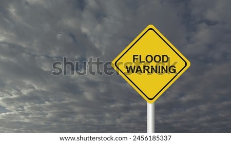 Hurricane Idalia warning sign against a powerful stormy background with copy space. Dirty and angled sign with cyclonic winds add to the drama.hurricane season sign on cloudy background Royalty-Free Stock Photo #2456185337