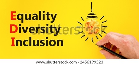EDI equality diversity inclusion symbol. Concept words EDI equality diversity inclusion on yellow paper. Beautiful yellow background. Business EDI equality diversity inclusion concept. Copy space.