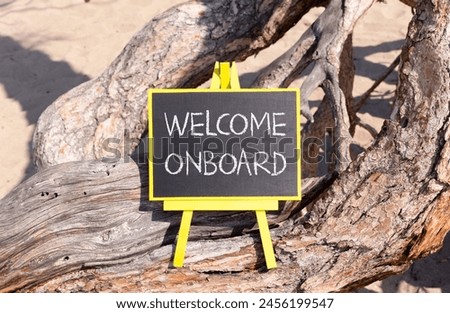 Welcome onboard symbol. Concept words Welcome onboard on beautiful black yellow blackboard. Beautiful tree background. Business, motivational welcome onboard concept. Copy space.