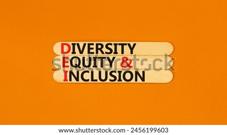 DEI diversity equity and inclusion symbol. Concept words DEI diversity equity and inclusion on stick. Beautiful orange background. Business DEI diversity equity and inclusion concept. Copy space.