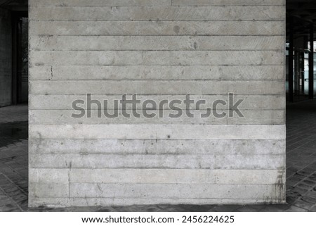 Concrete wall with horizontal lines and subtle textures. Urban construction background. Modern architecture detail. Design for background, wallpaper, or architectural presentations.